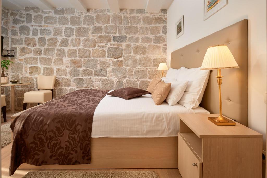 Postel nebo postele na pokoji v ubytování Lanterna Rooms