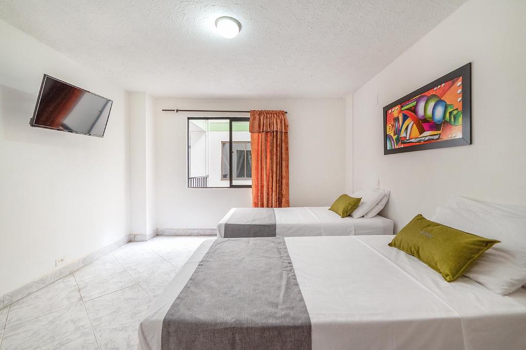 Postel nebo postele na pokoji v ubytování Hotel Balcones del Estadio
