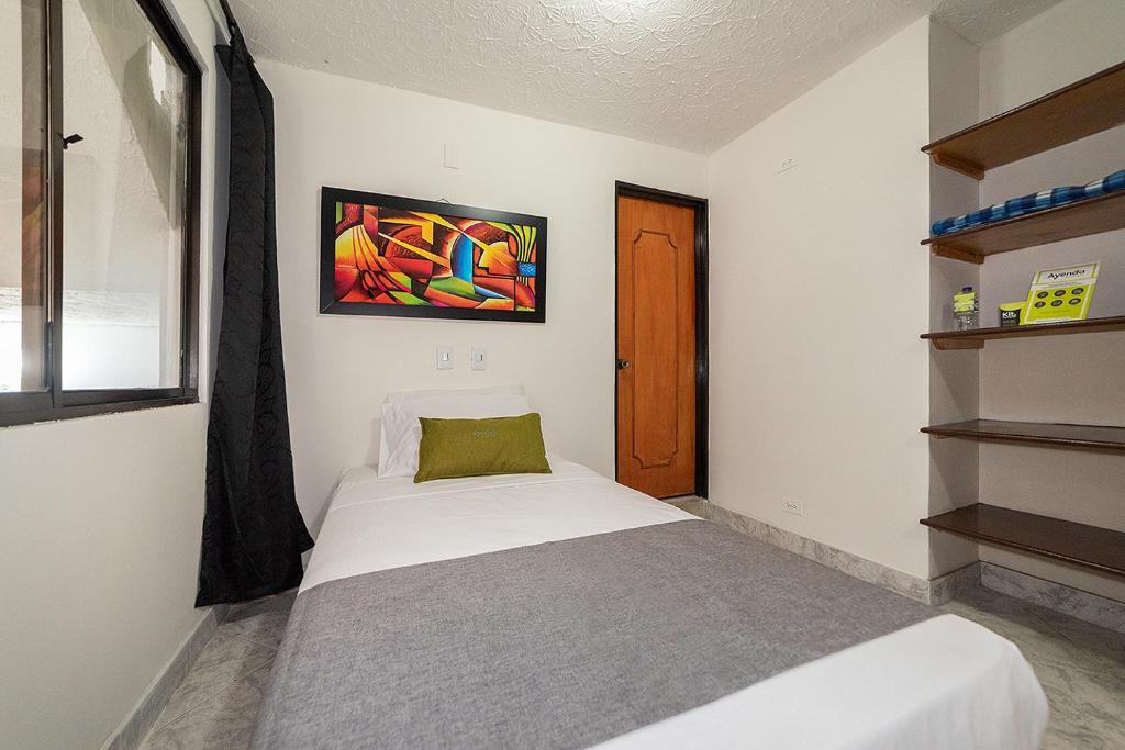 Postel nebo postele na pokoji v ubytování Hotel Balcones del Estadio