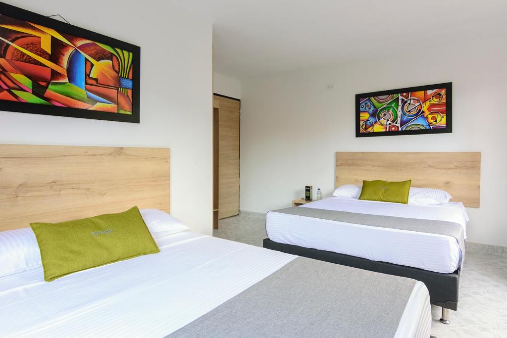 Postel nebo postele na pokoji v ubytování Hotel Balcones del Estadio
