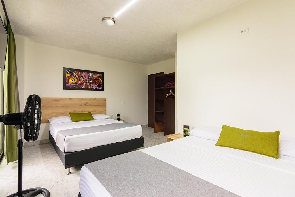 Postel nebo postele na pokoji v ubytování Hotel Balcones del Estadio