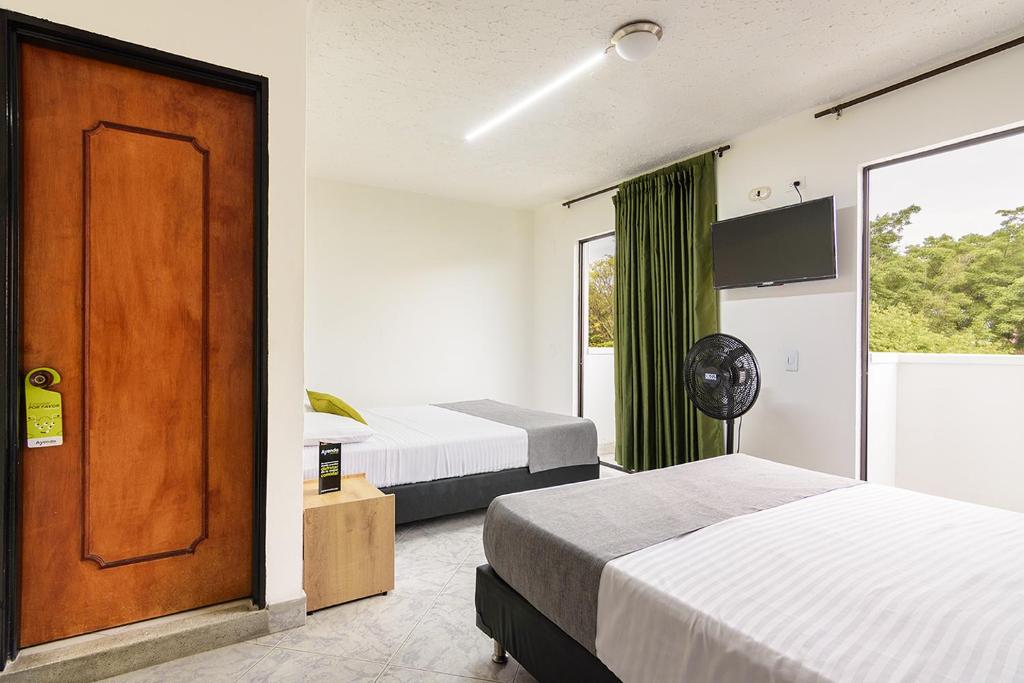 Postel nebo postele na pokoji v ubytování Hotel Balcones del Estadio