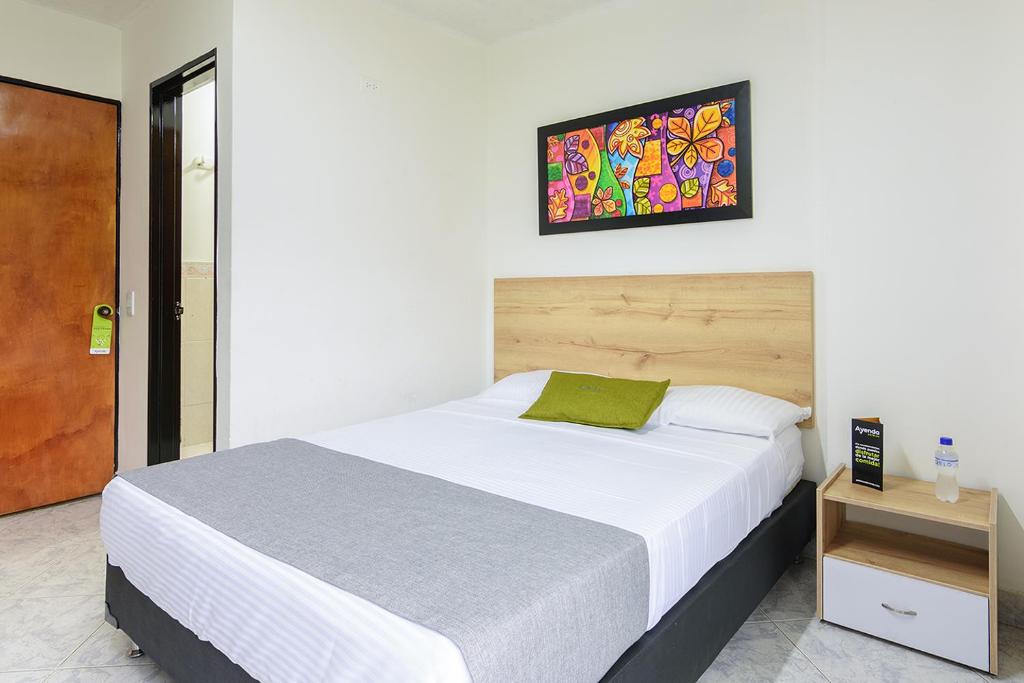 Postel nebo postele na pokoji v ubytování Hotel Balcones del Estadio