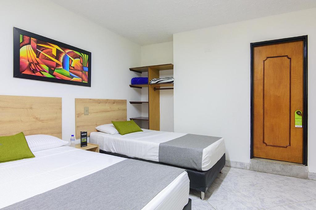 Postel nebo postele na pokoji v ubytování Hotel Balcones del Estadio