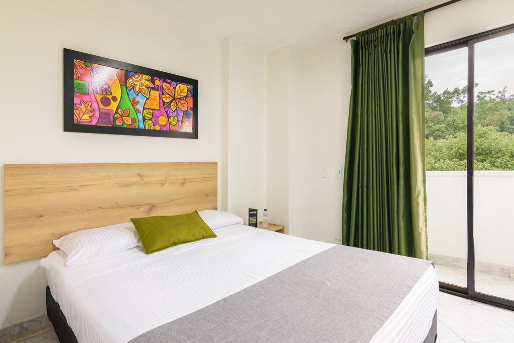 Postel nebo postele na pokoji v ubytování Hotel Balcones del Estadio