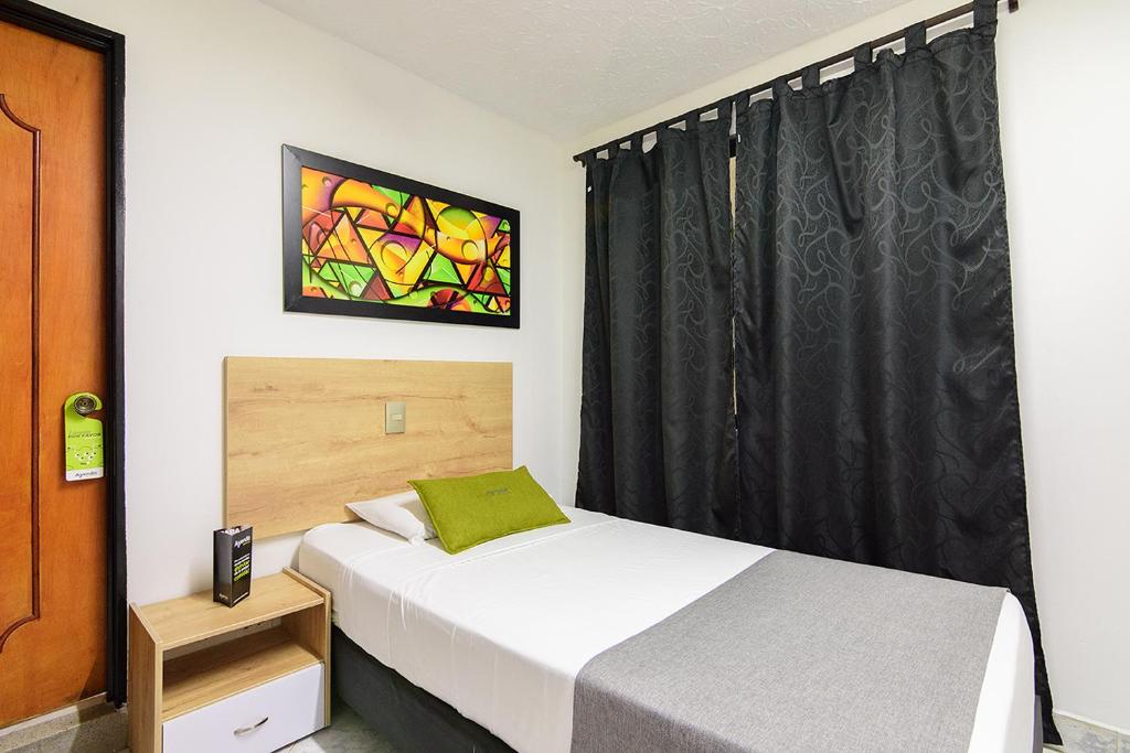 Postel nebo postele na pokoji v ubytování Hotel Balcones del Estadio
