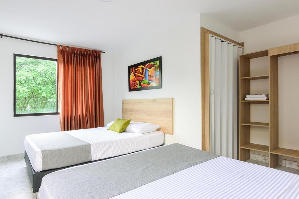 Postel nebo postele na pokoji v ubytování Hotel Balcones del Estadio