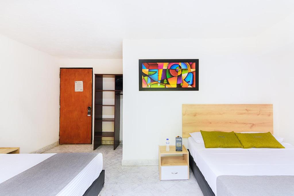 Postel nebo postele na pokoji v ubytování Hotel Balcones del Estadio