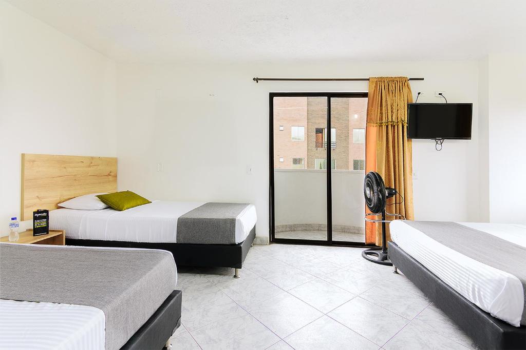 Postel nebo postele na pokoji v ubytování Hotel Balcones del Estadio