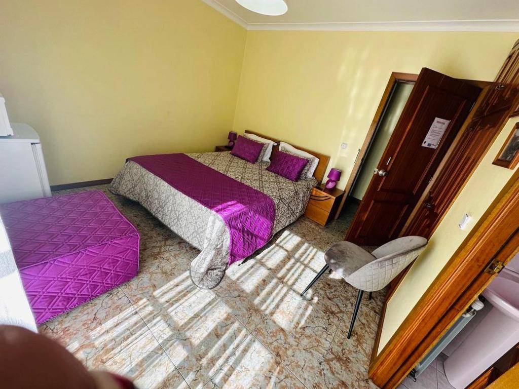 Postel nebo postele na pokoji v ubytování Residência Iris