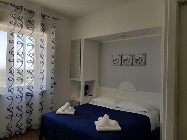 Postel nebo postele na pokoji v ubytování Hotel La Plancia