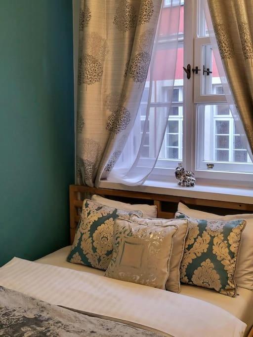 Posteľ alebo postele v izbe v ubytovaní APARTAMENTY-MI PLAC ZAMKOWY