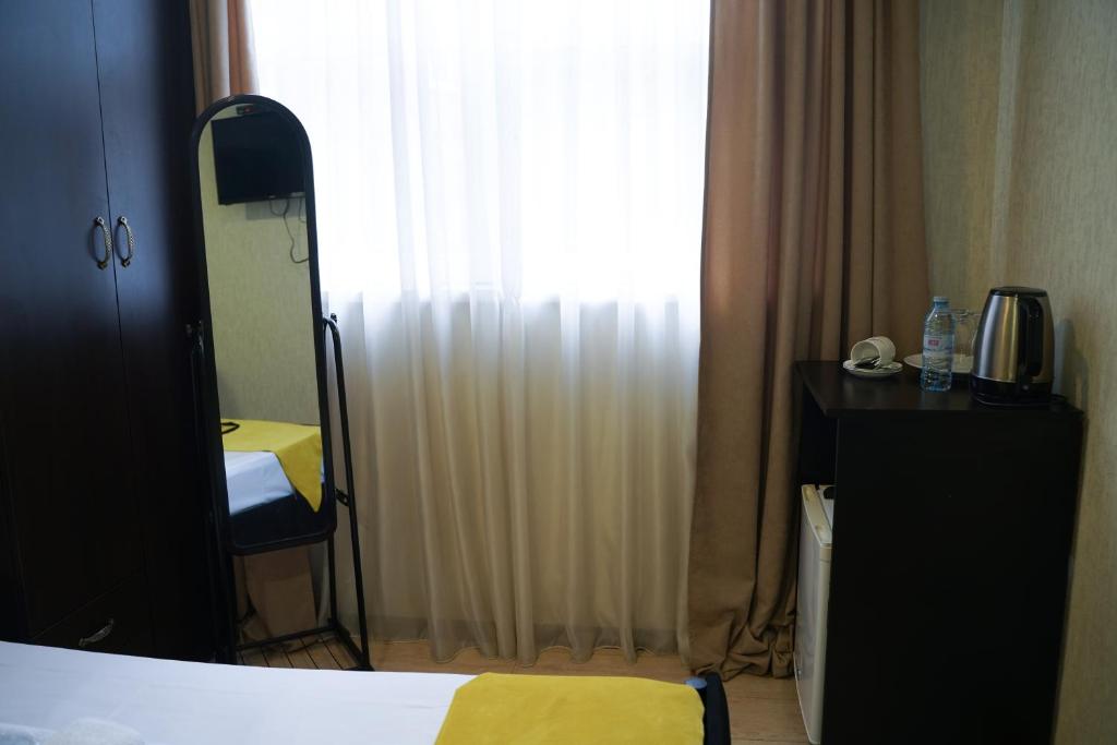 Postel nebo postele na pokoji v ubytování Aura Plaza Hotel