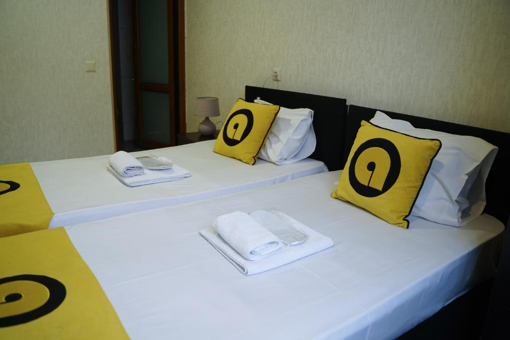 Postel nebo postele na pokoji v ubytování Aura Plaza Hotel
