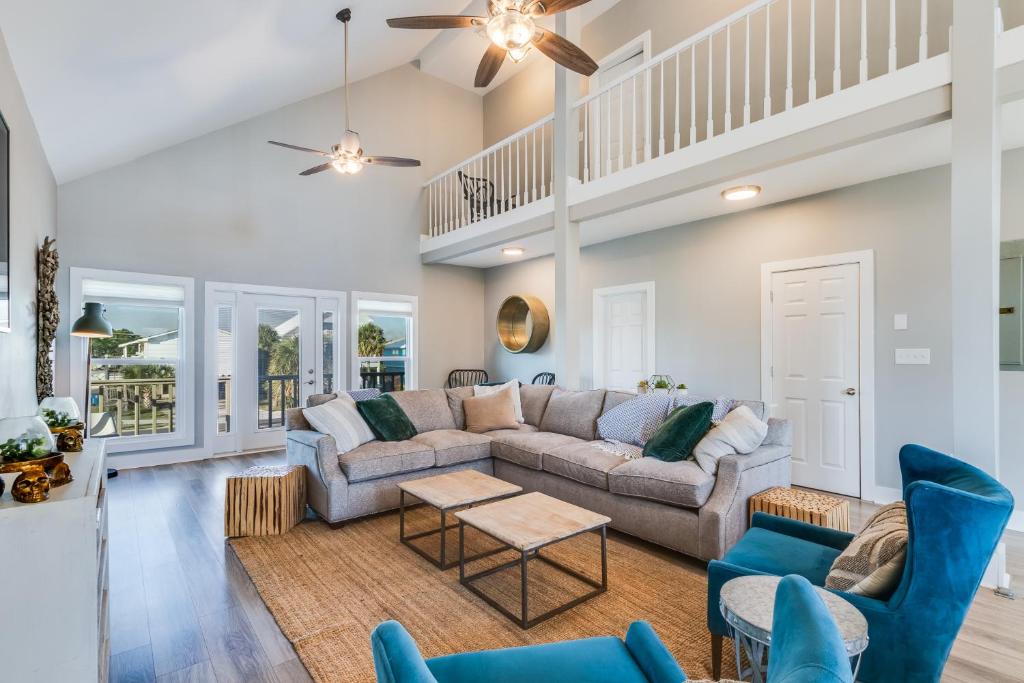 a living room with a couch and chairs at Modern, 3 BR Private House within Walking Distance to the Beach! in Gulf Shores