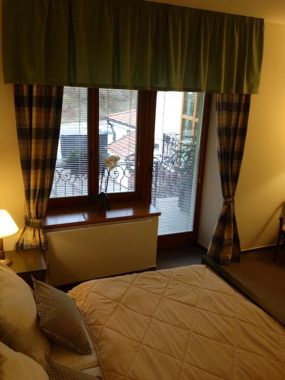 Postel nebo postele na pokoji v ubytování Hotel Pod Zamkem
