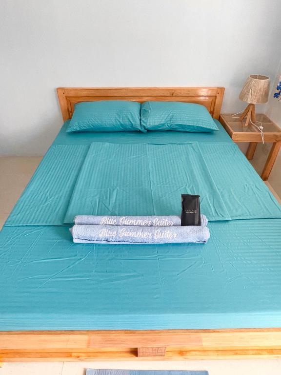 Postel nebo postele na pokoji v ubytování Blue Summer Suites & Restaurant