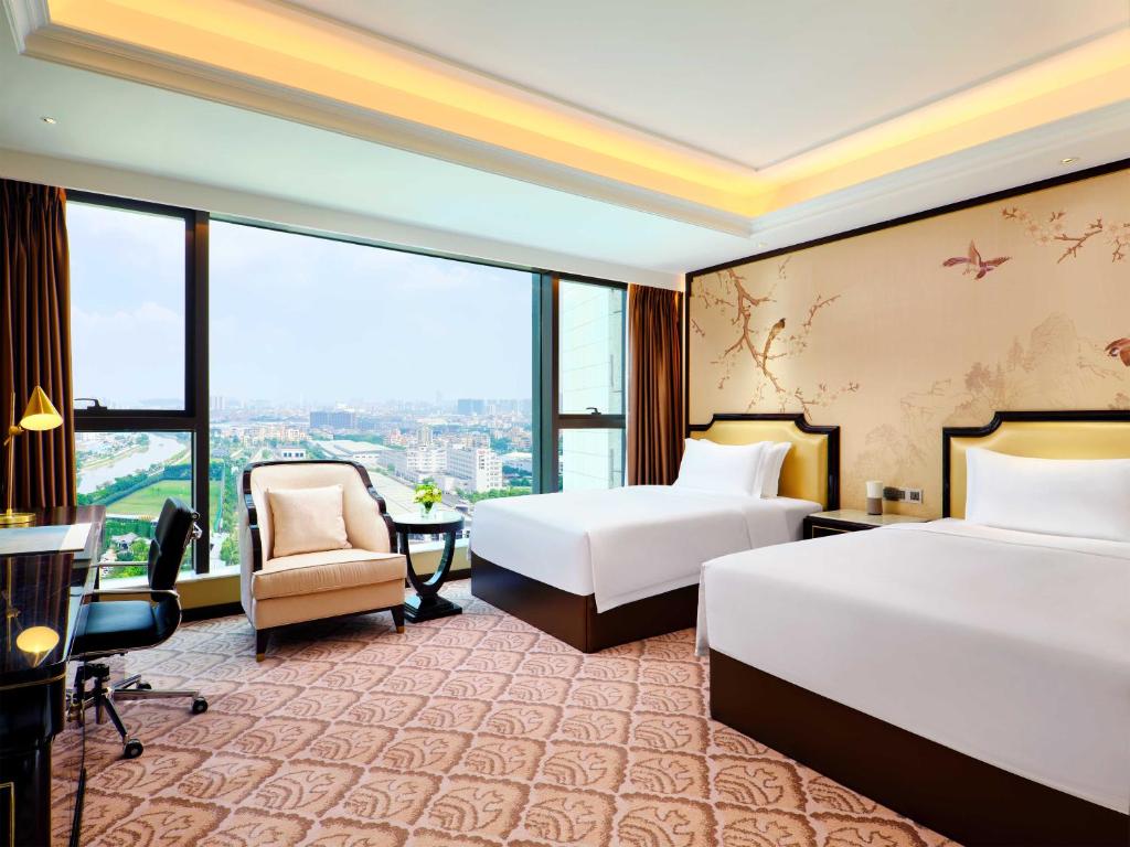 Postel nebo postele na pokoji v ubytování The Yun Hotel Foshan Nanhai-Near Pazhou Complex
