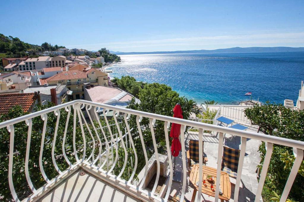 a balcony with a view of the ocean at Holiday Home Luma in Podgora