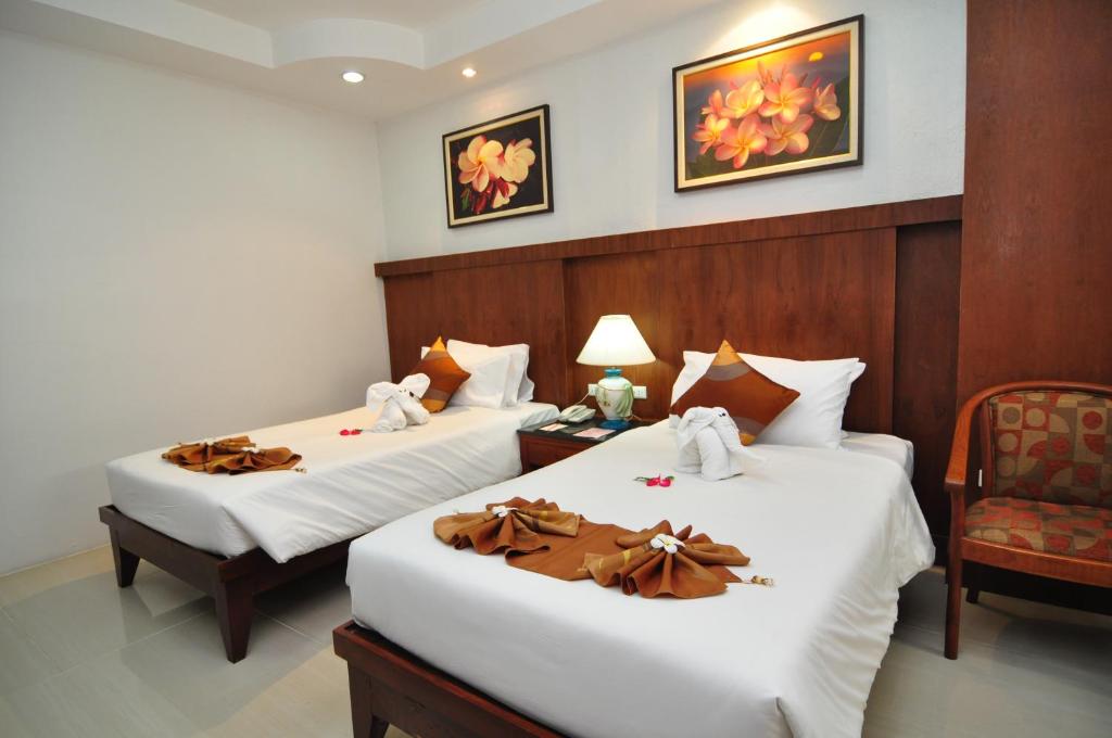 Postel nebo postele na pokoji v ubytování Phuket Leelavadee Hua Ting Resort