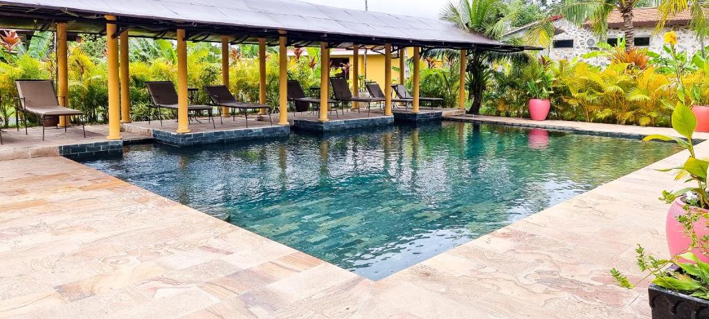 a swimming pool in the middle of a house at Villa Pacha in Kampot