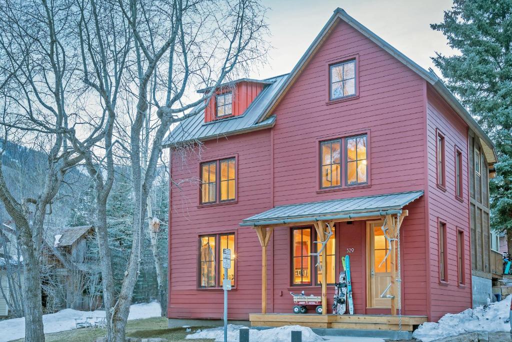 a red house with a gambrel at Sun-Filled Sunnyside Home On North Fir St - Eco-Friendly Home - Peace & Privacy home in Telluride