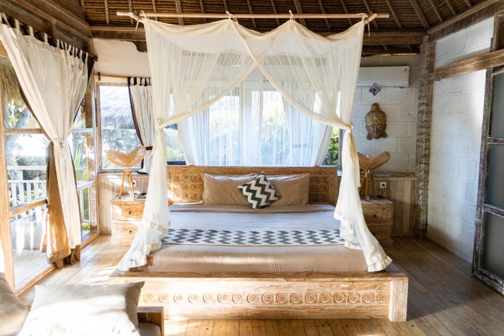 Postel nebo postele na pokoji v ubytování Le Yanandra Bali Resort