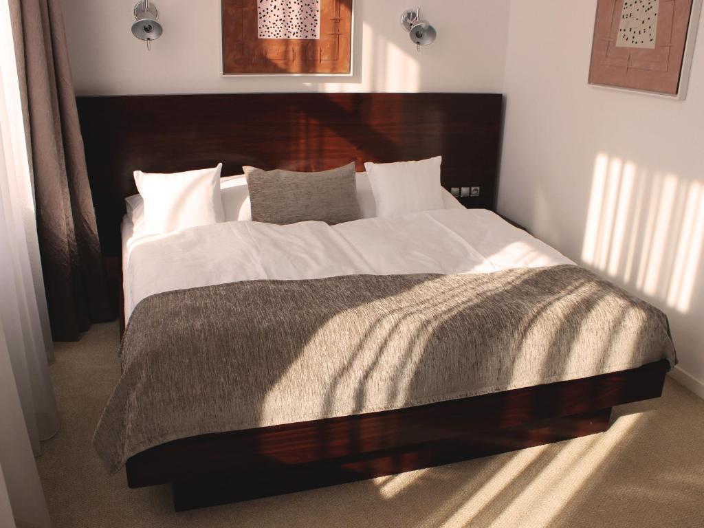 Postel nebo postele na pokoji v ubytování Hotel Lev