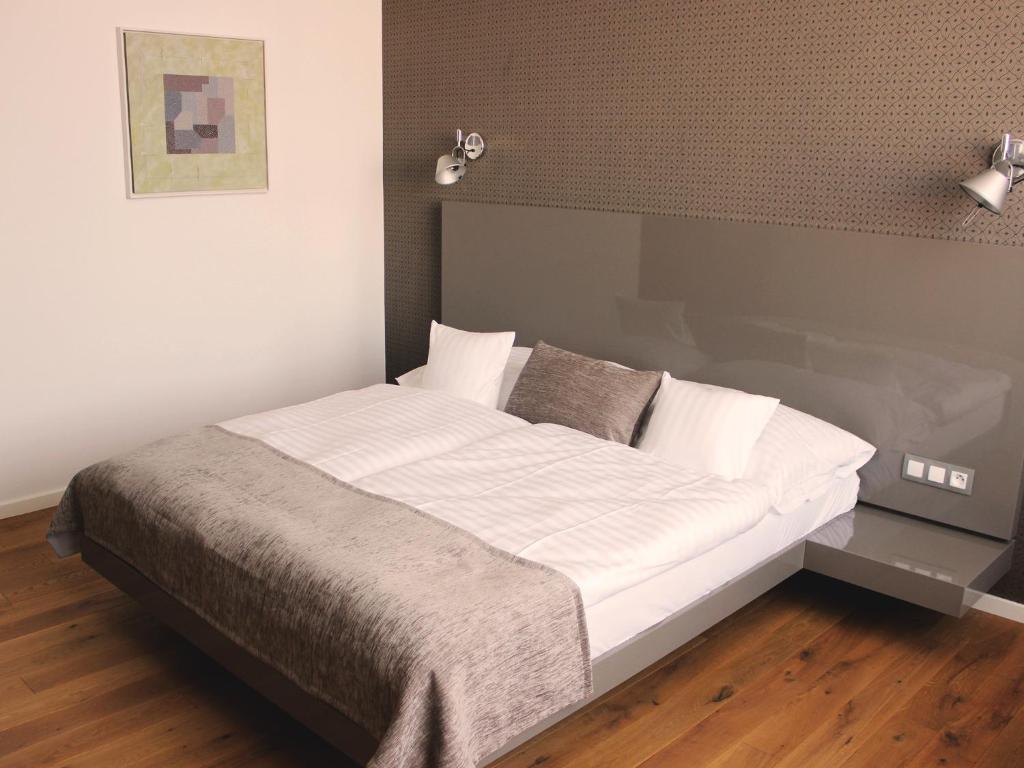 Postel nebo postele na pokoji v ubytování Hotel Lev