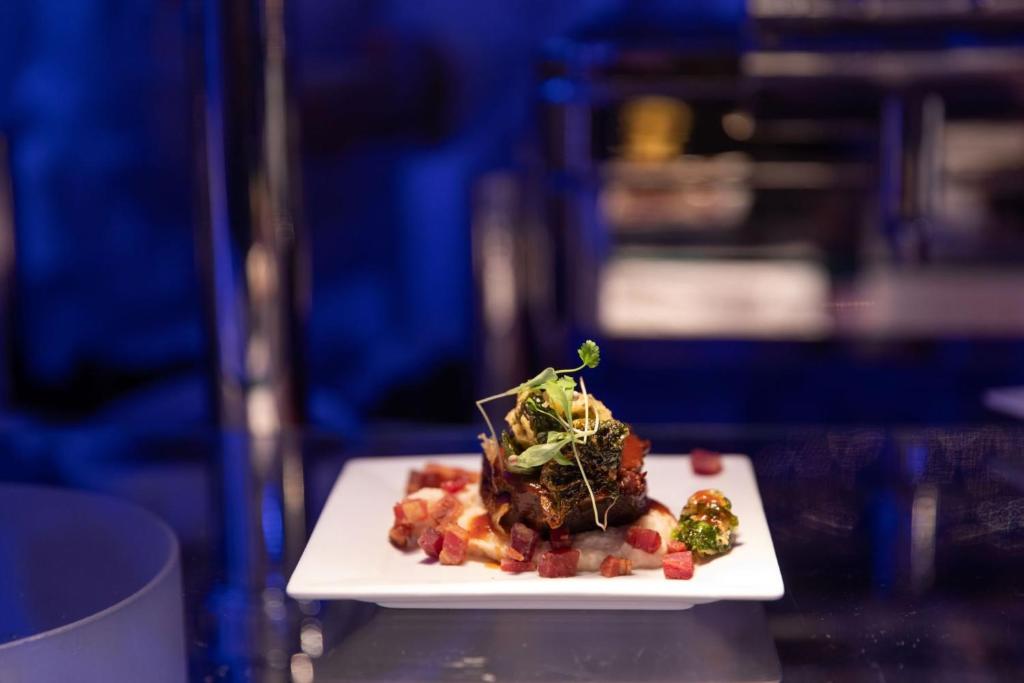 a plate of food sitting on a table at InterContinental Boston by IHG in Boston