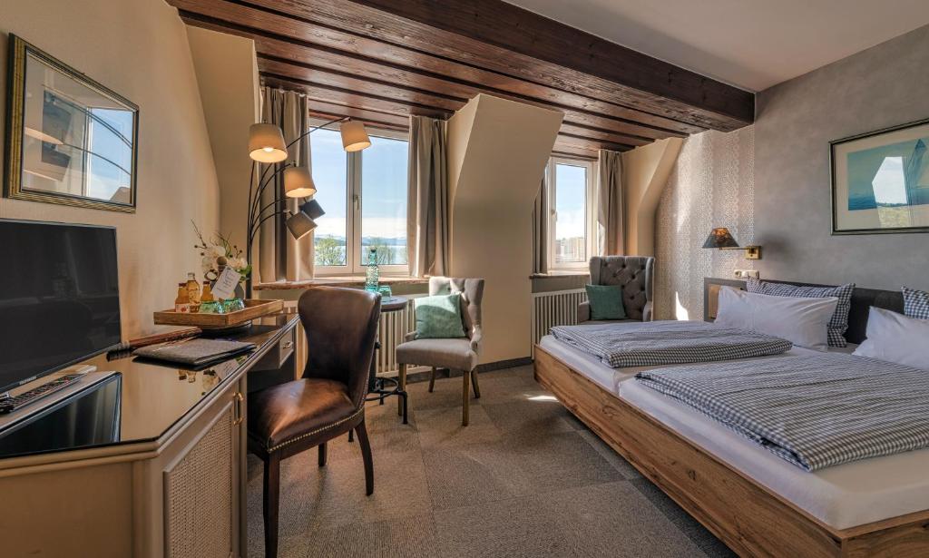 Postel nebo postele na pokoji v ubytování Hotel Starnberger See