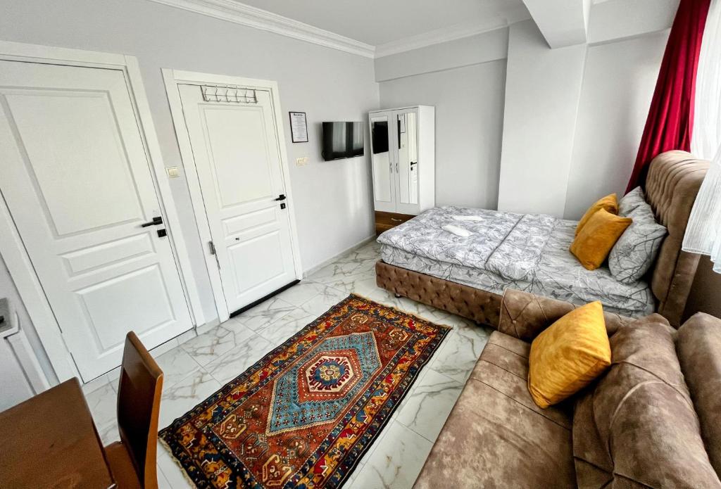 Postel nebo postele na pokoji v ubytování Pembe Hotel