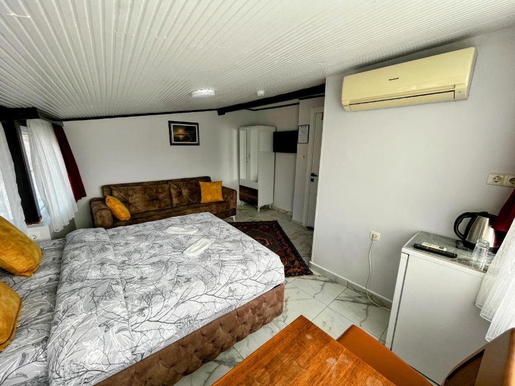 Postel nebo postele na pokoji v ubytování Pembe Hotel