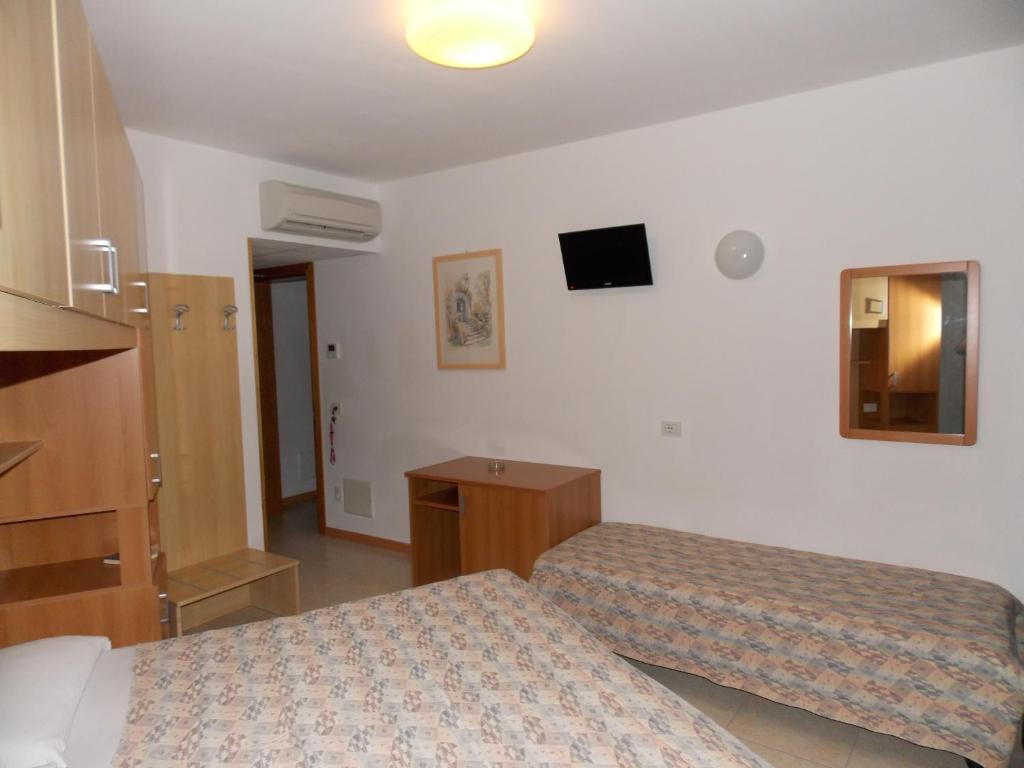 Postel nebo postele na pokoji v ubytování Hotel Colorado