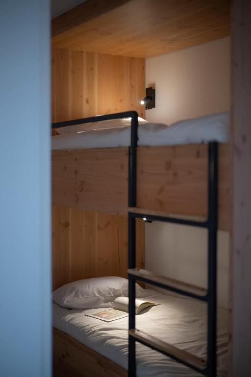 a couple of bunk beds in a room at L&#39;Orée des Sources in Volvic