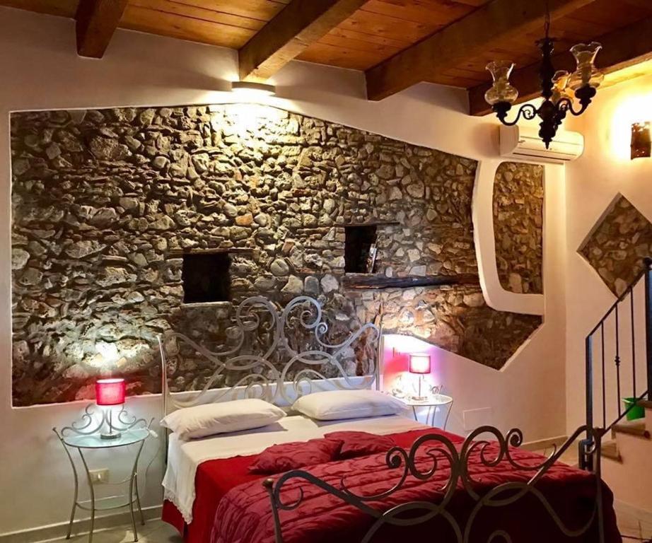 Postel nebo postele na pokoji v ubytování La Magara