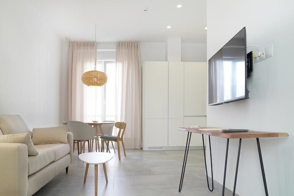 Televízia a/alebo spoločenská miestnosť v ubytovaní CASA DE LA VEGA SUITES