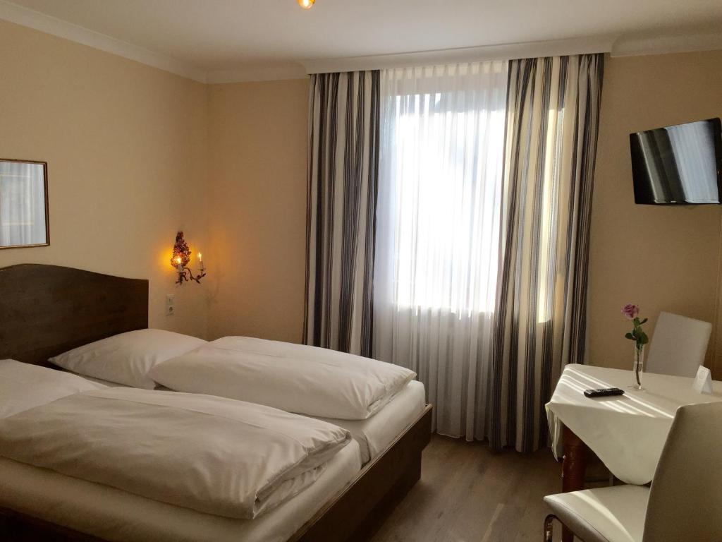 Postel nebo postele na pokoji v ubytování Hotel Sollner Hof
