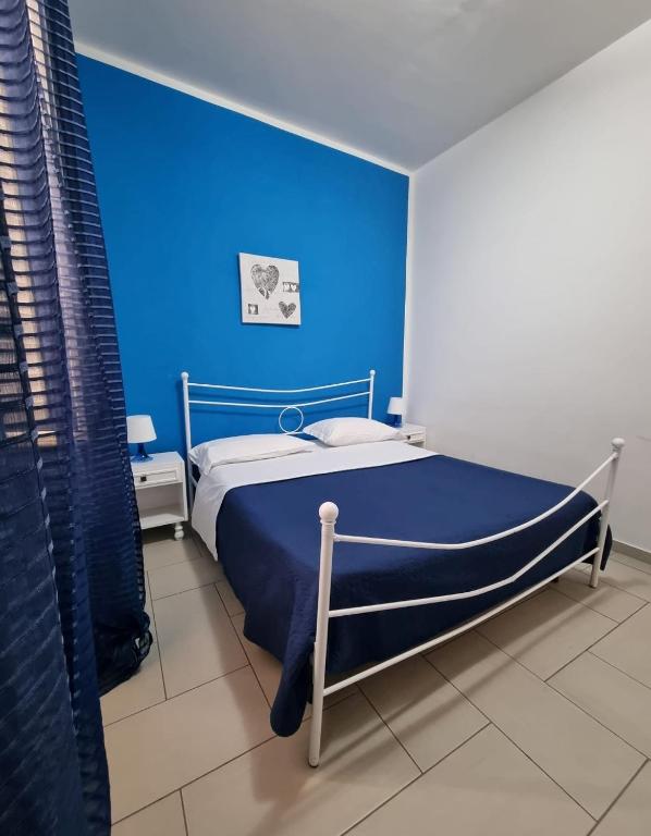 A bed or beds in a room at Terrazza del Santo 2,0 - La Terrazza nel cuore di Napoli