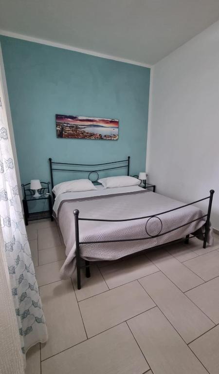 A bed or beds in a room at Terrazza del Santo 2,0 - La Terrazza nel cuore di Napoli