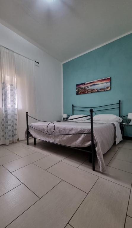 A bed or beds in a room at Terrazza del Santo 2,0 - La Terrazza nel cuore di Napoli