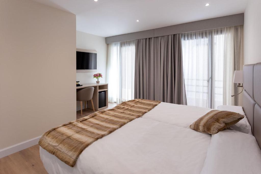 Postel nebo postele na pokoji v ubytování Hotel SAIOLA