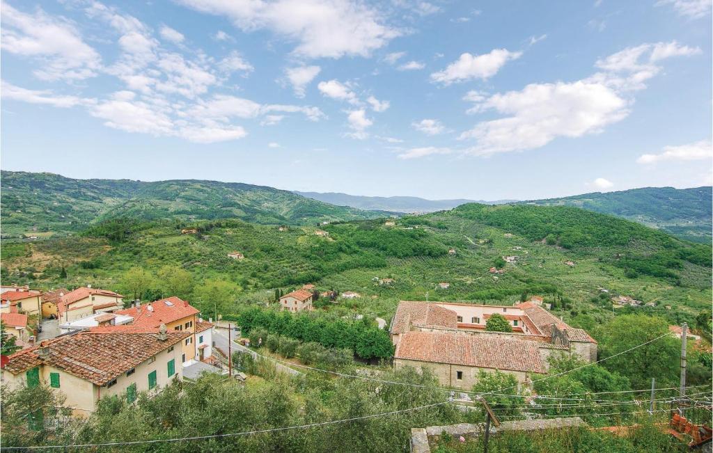 a group of houses on a hill with mountains at Stunning Home In Montecatini Alto in Nievole