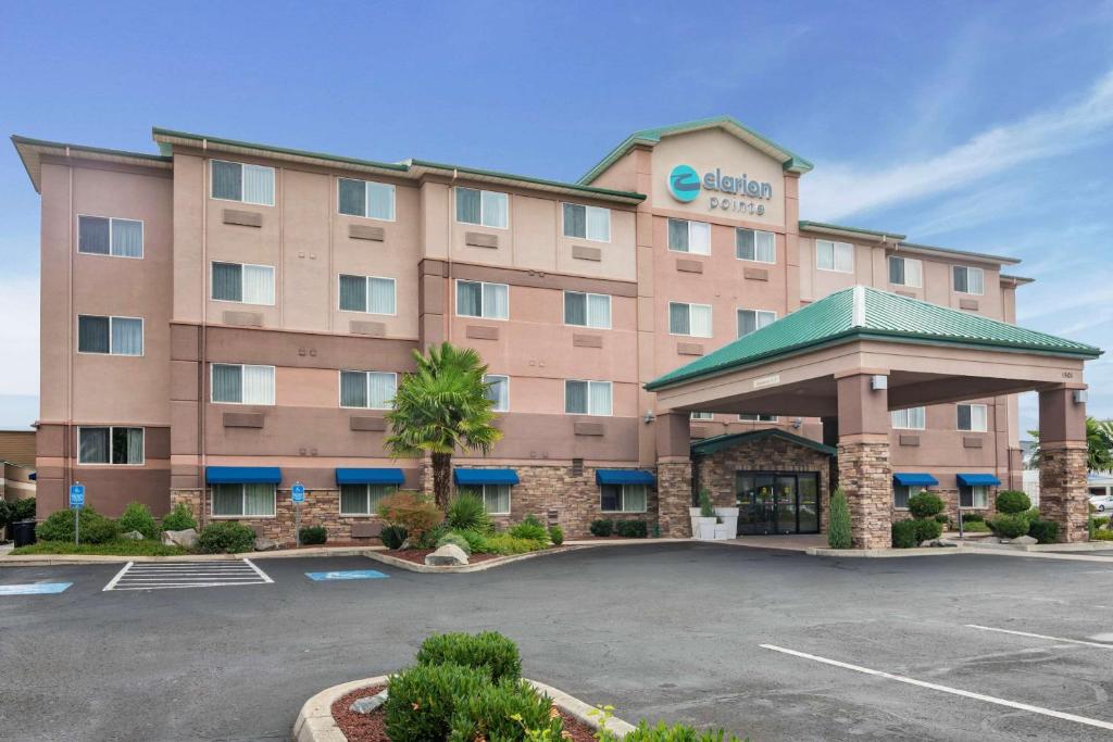 a rendering of a hotel with a parking lot at Clarion Pointe Medford in Medford