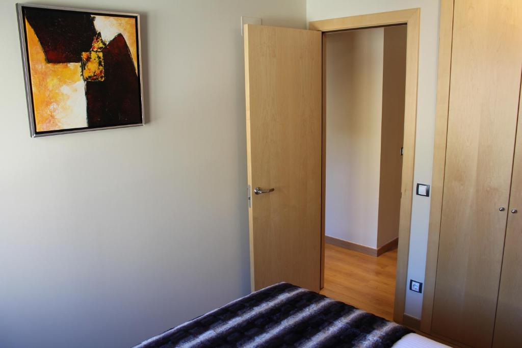 Postel nebo postele na pokoji v ubytování Apartaments Ashome