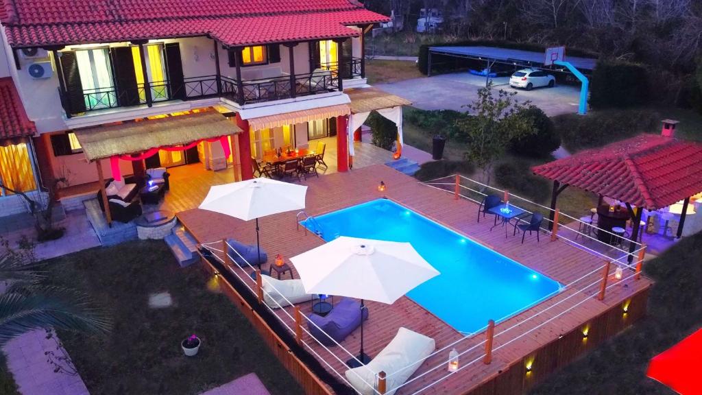 an aerial view of a house with a swimming pool at Villa Laguna in Vourvourou