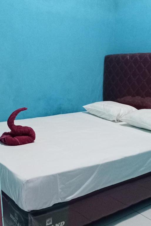 Postel nebo postele na pokoji v ubytování Raja Ampat Sandy Guest House