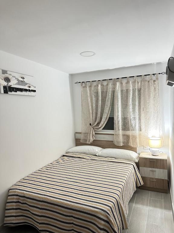 Posteľ alebo postele v izbe v ubytovaní Apartamento FELICIA