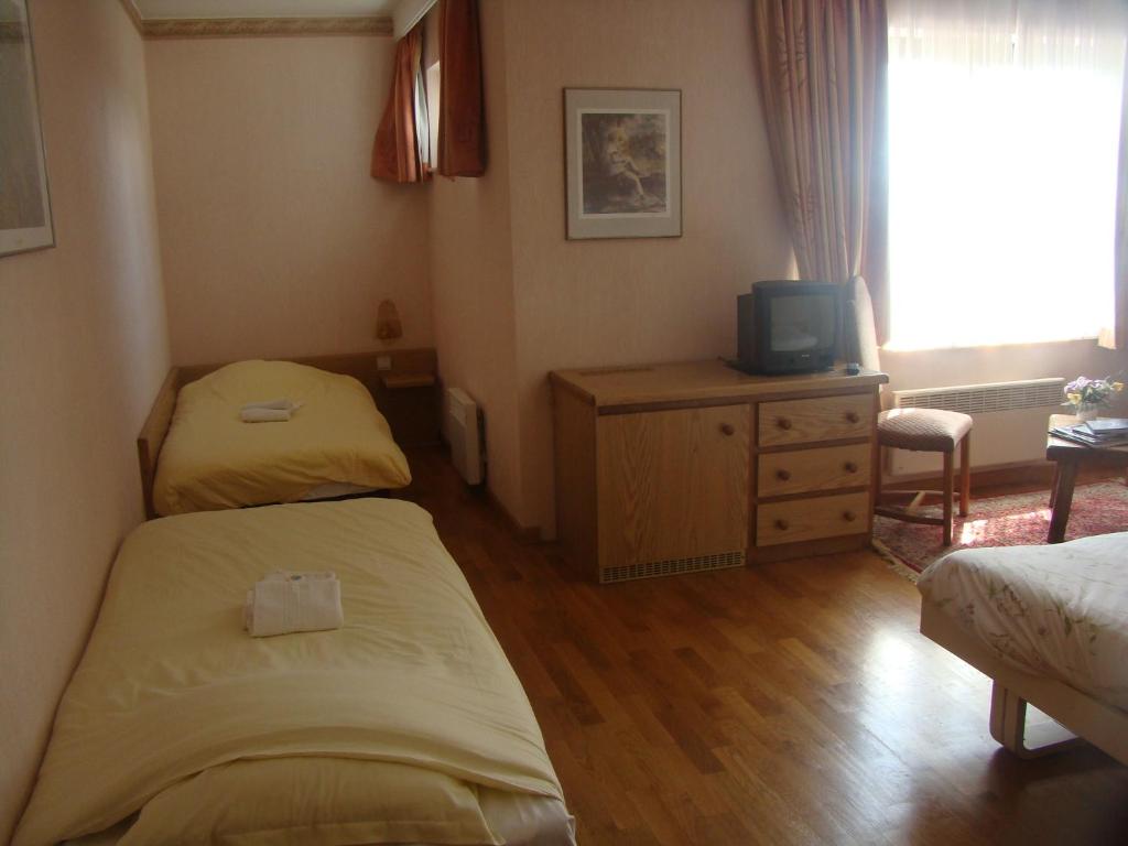 Postel nebo postele na pokoji v ubytování Hôtel Restaurant N 4
