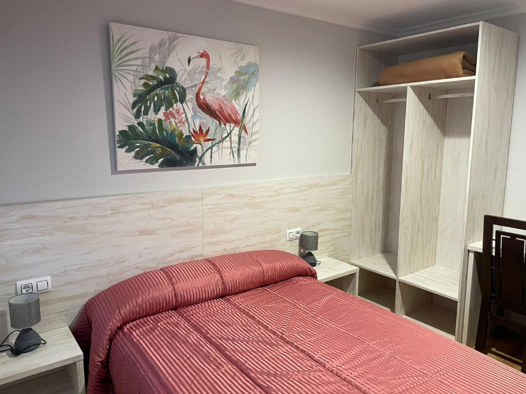 Posteľ alebo postele v izbe v ubytovaní HOSTAL CID